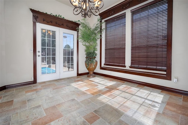 9124 SW 28th St, Oklahoma City, OK 73128 - unfurnished dining area with stone tile floors and a chandelier