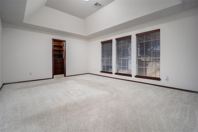 9124 SW 28th St, Oklahoma City, OK 73128 - empty room with light colored carpet and a raised ceiling