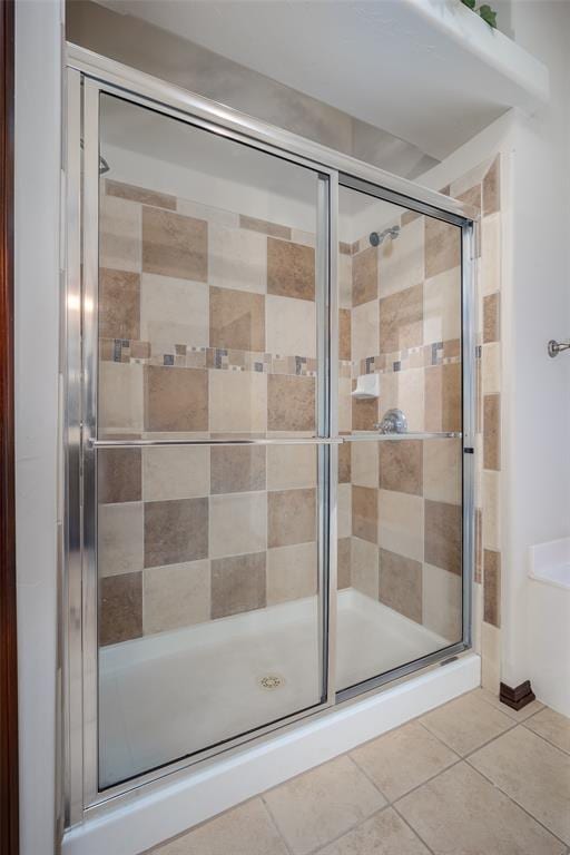 9124 SW 28th St, Oklahoma City, OK 73128 - full bathroom featuring a shower stall and tile patterned floors