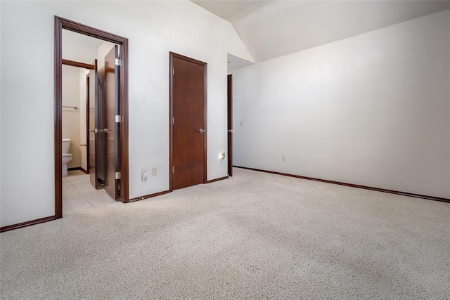9124 SW 28th St, Oklahoma City, OK 73128 - unfurnished bedroom with vaulted ceiling and carpet