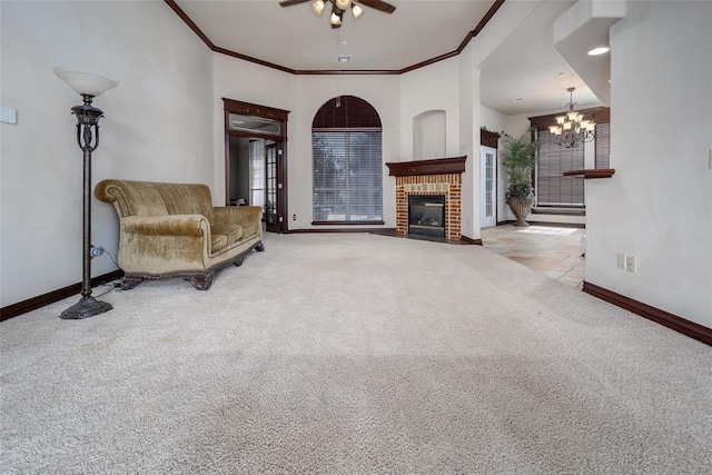 9124 SW 28th St, Oklahoma City, OK 73128 - carpeted living room with ornamental molding, plenty of natural light, a ceiling fan, a chandelier, and a brick fireplace