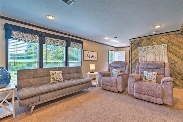 86 Crooked Oaks Ln, Broken Bow, OK 74728 - carpeted living area with ornamental molding, recessed lighting, and a textured ceiling