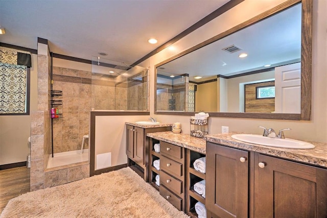 86 Crooked Oaks Ln, Broken Bow, OK 74728 - bathroom featuring walk in shower, two vanities, and recessed lighting