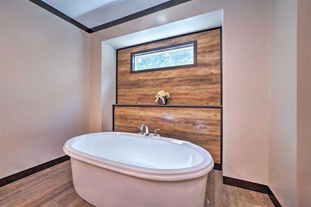 86 Crooked Oaks Ln, Broken Bow, OK 74728 - bathroom with a freestanding tub and wood finished floors