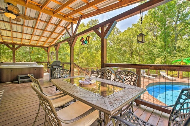 86 Crooked Oaks Ln, Broken Bow, OK 74728 - wooden deck with a hot tub, area for grilling, outdoor dining area, and ceiling fan