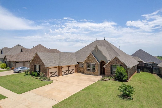 3000 Warwick Pl, Edmond, OK 73013 - french country home featuring an attached garage, brick siding, a shingled roof, and concrete driveway
