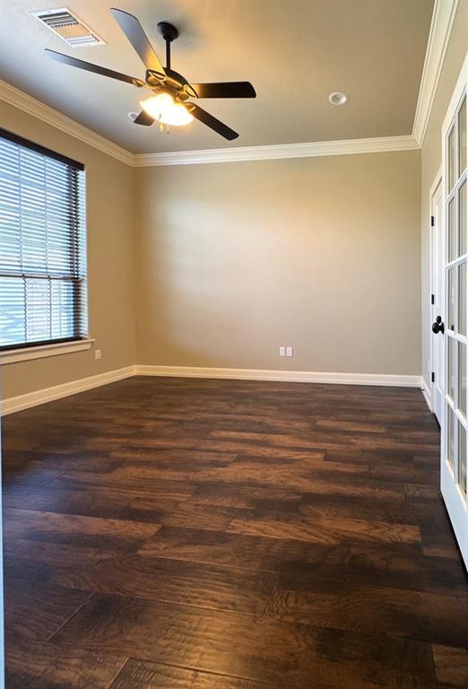 3000 Warwick Pl, Edmond, OK 73013 - spare room featuring crown molding, dark wood-style floors, a ceiling fan, and recessed lighting