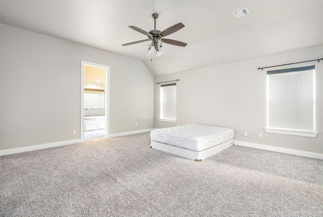 3000 Warwick Pl, Edmond, OK 73013 - carpeted bedroom featuring vaulted ceiling, ensuite bath, and ceiling fan