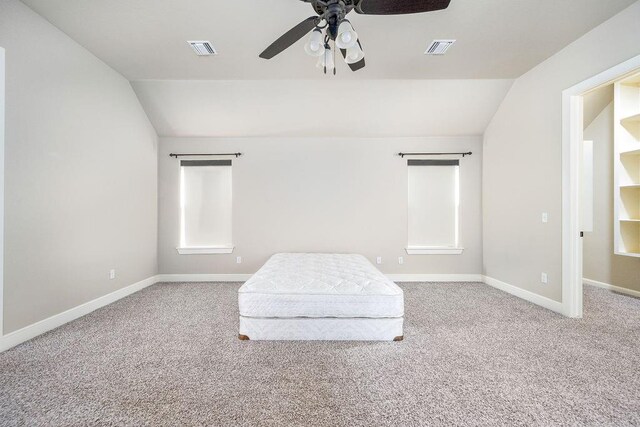 3000 Warwick Pl, Edmond, OK 73013 - unfurnished bedroom with vaulted ceiling, carpet floors, and a ceiling fan