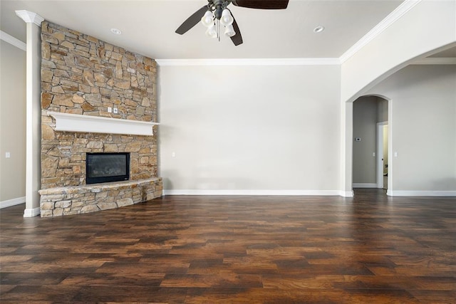 3000 Warwick Pl, Edmond, OK 73013 - unfurnished living room with ceiling fan, ornamental molding, wood finished floors, arched walkways, and a fireplace
