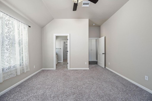 3000 Warwick Pl, Edmond, OK 73013 - unfurnished bedroom featuring carpet, vaulted ceiling, and ceiling fan
