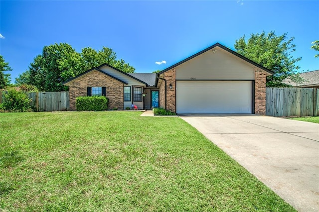 16408 Del Mar Dr, Edmond, OK 73013 - ranch-style home featuring brick siding, an attached garage, and concrete driveway