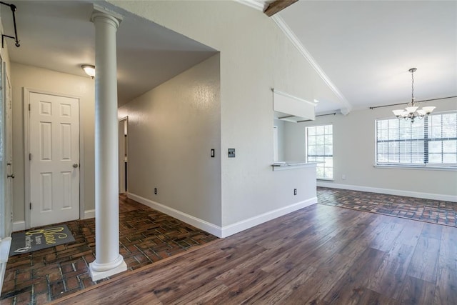 16408 Del Mar Dr, Edmond, OK 73013 - empty room featuring decorative columns, wood finished floors, and a chandelier