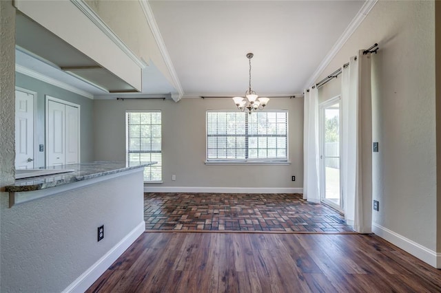 16408 Del Mar Dr, Edmond, OK 73013 - unfurnished dining area with crown molding, a chandelier, healthy amount of natural light, and dark wood finished floors
