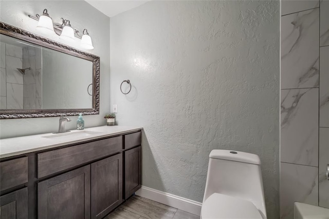 16408 Del Mar Dr, Edmond, OK 73013 - bathroom with vanity, a textured wall, and bathtub / shower combination