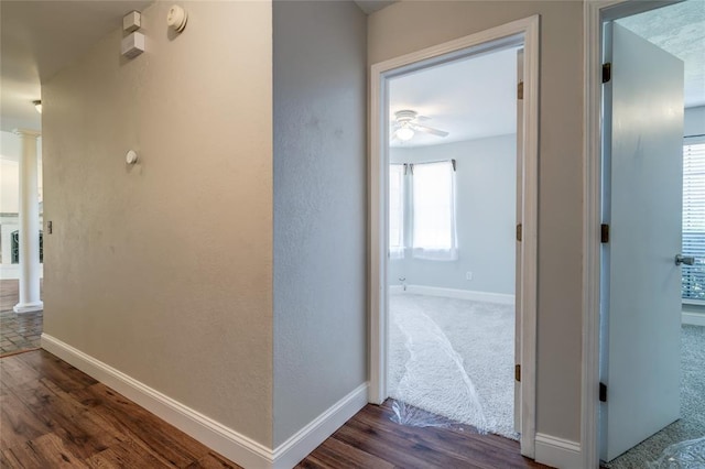 16408 Del Mar Dr, Edmond, OK 73013 - hall featuring ornate columns and dark wood-style floors