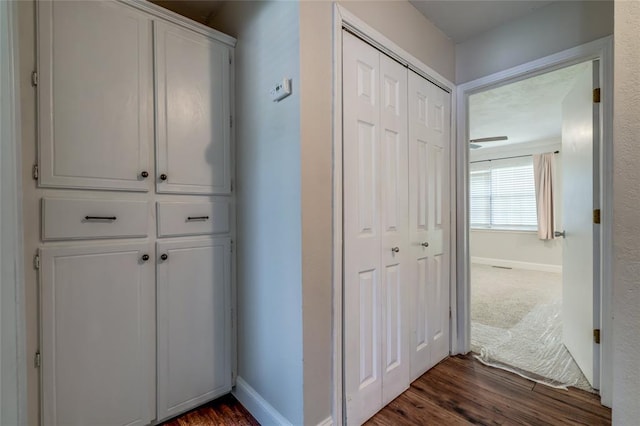 16408 Del Mar Dr, Edmond, OK 73013 - corridor featuring dark wood-style flooring and baseboards