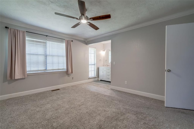 16408 Del Mar Dr, Edmond, OK 73013 - unfurnished bedroom with crown molding, carpet flooring, ceiling fan, and a textured ceiling