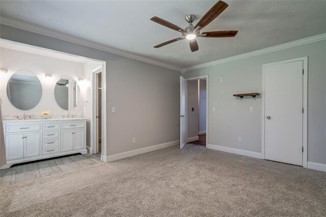 16408 Del Mar Dr, Edmond, OK 73013 - unfurnished bedroom with ensuite bath, crown molding, light colored carpet, and ceiling fan