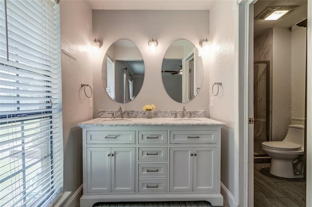 16408 Del Mar Dr, Edmond, OK 73013 - full bath featuring double vanity, wood finished floors, and a shower