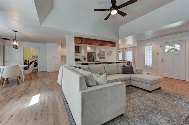 1001 Fountain Gate Cir, Norman, OK 73072 - living room featuring light wood finished floors, a ceiling fan, washer and clothes dryer, and recessed lighting