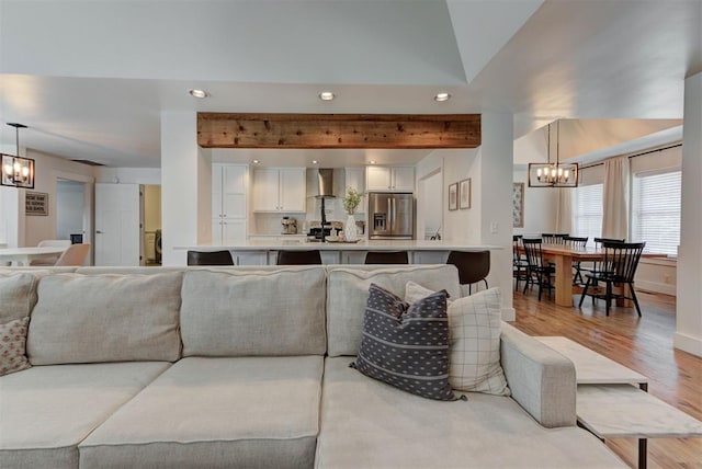 1001 Fountain Gate Cir, Norman, OK 73072 - living room with a chandelier, recessed lighting, light wood-type flooring, and beamed ceiling