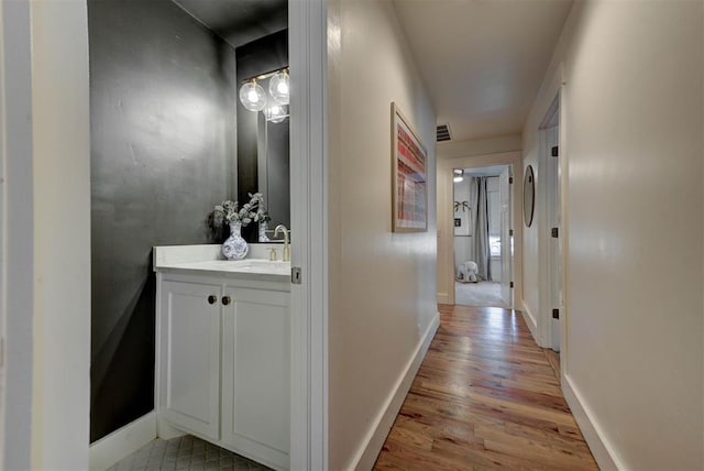 1001 Fountain Gate Cir, Norman, OK 73072 - corridor featuring light wood-type flooring and baseboards