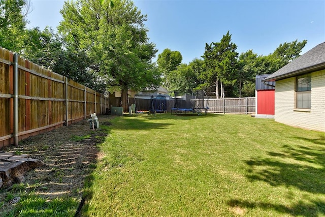 1001 Fountain Gate Cir, Norman, OK 73072 - fenced backyard with a trampoline