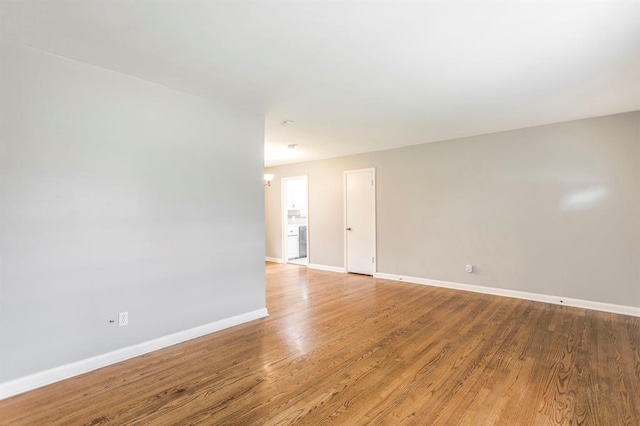 3020 NW 71st St, Oklahoma City, OK 73116 - unfurnished room featuring baseboards and wood finished floors