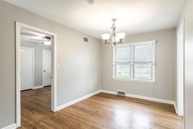 3020 NW 71st St, Oklahoma City, OK 73116 - empty room featuring a chandelier, wood finished floors, and ceiling fan