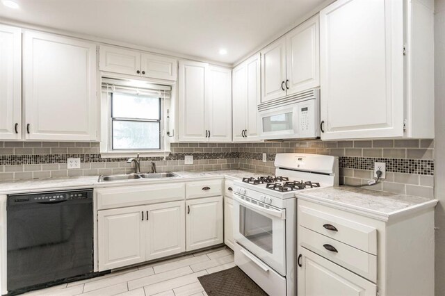 3020 NW 71st St, Oklahoma City, OK 73116 - kitchen featuring white appliances, light countertops, white cabinetry, and recessed lighting