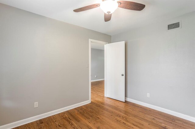3020 NW 71st St, Oklahoma City, OK 73116 - unfurnished room with a ceiling fan and wood finished floors