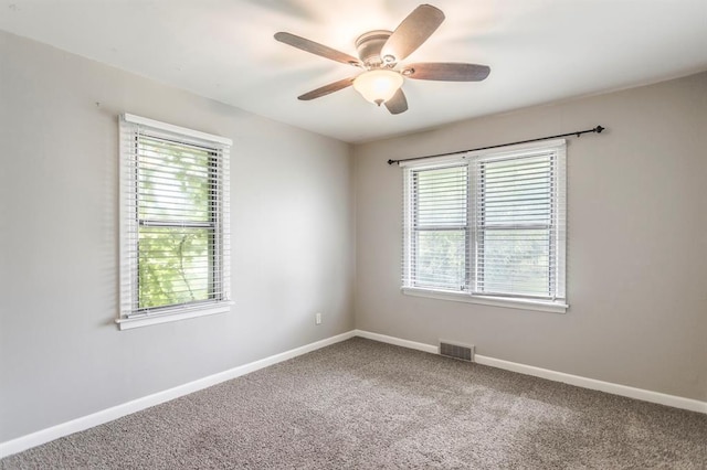 3020 NW 71st St, Oklahoma City, OK 73116 - carpeted spare room featuring plenty of natural light and a ceiling fan