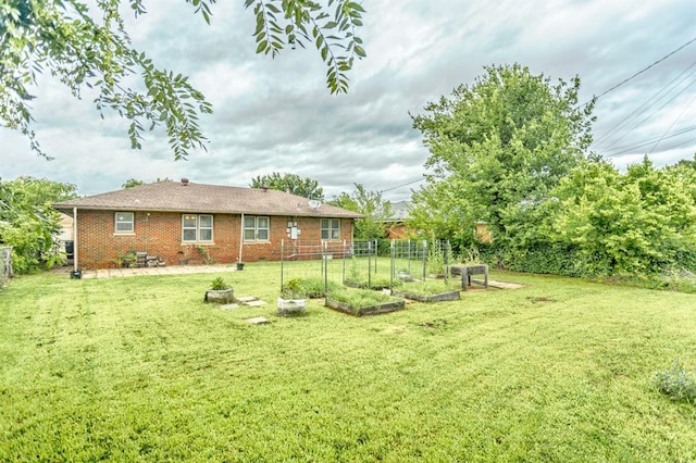3020 NW 71st St, Oklahoma City, OK 73116 - view of yard featuring a vegetable garden