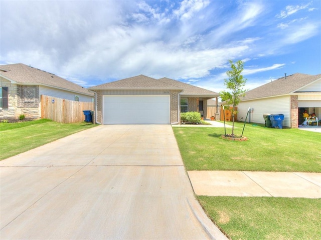 2020 Dillards Dr, Chickasha, OK 73018 - view of front facade with brick siding, driveway, and a garage