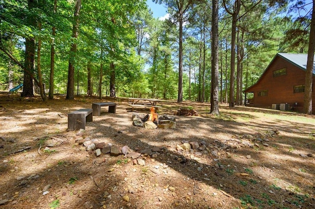 244 Hiddenwater Rd, Broken Bow, OK 74728 - view of yard with an outdoor fire pit