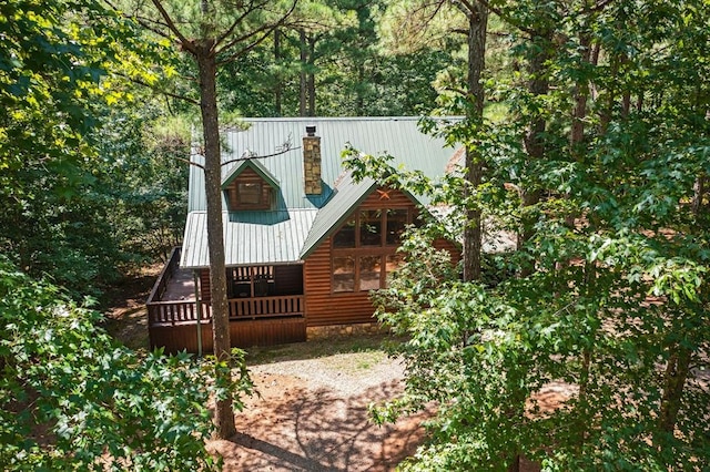 244 Hiddenwater Rd, Broken Bow, OK 74728 - back of property featuring a chimney, log veneer siding, and a metal roof