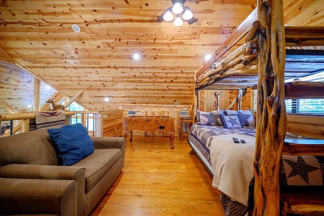 244 Hiddenwater Rd, Broken Bow, OK 74728 - bedroom with wooden ceiling, wooden walls, light wood finished floors, and lofted ceiling