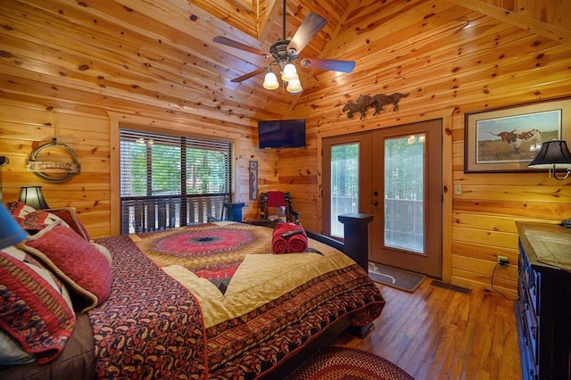 244 Hiddenwater Rd, Broken Bow, OK 74728 - bedroom with french doors, access to outside, wooden walls, and hardwood / wood-style floors