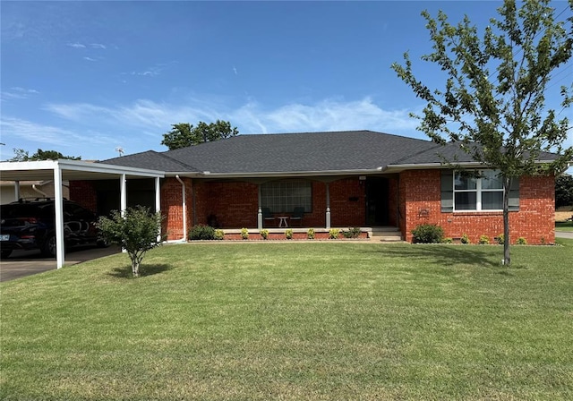 1901 N Oklahoma Ave, Shawnee, OK 74804 - single story home featuring brick siding, a front lawn, a shingled roof, and an attached carport
