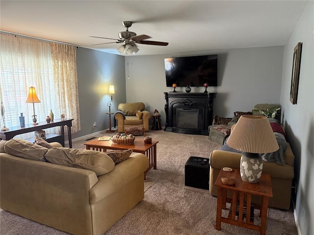 1901 N Oklahoma Ave, Shawnee, OK 74804 - carpeted living room featuring ceiling fan and a glass covered fireplace
