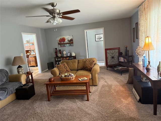 1901 N Oklahoma Ave, Shawnee, OK 74804 - living room with light carpet and ceiling fan