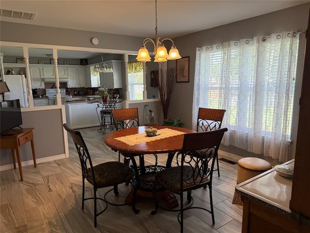 1901 N Oklahoma Ave, Shawnee, OK 74804 - dining space featuring a chandelier