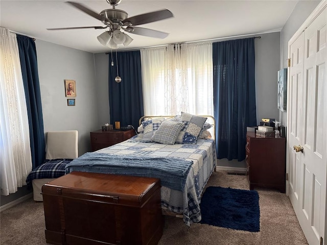 1901 N Oklahoma Ave, Shawnee, OK 74804 - carpeted bedroom with ceiling fan and a closet