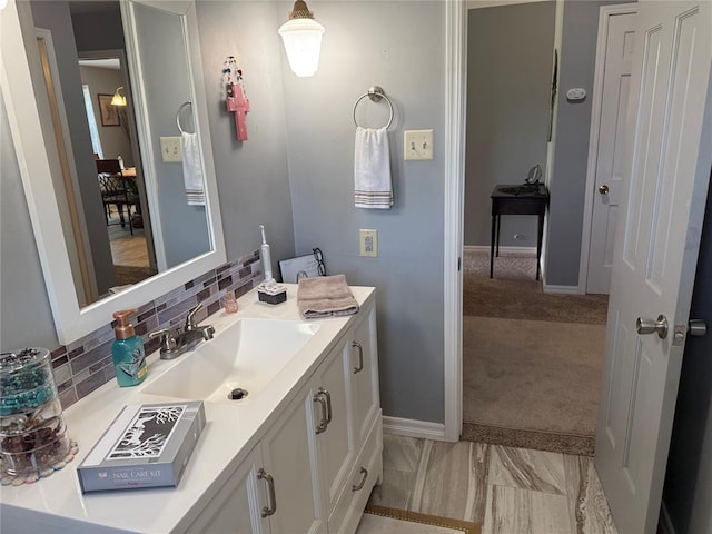 1901 N Oklahoma Ave, Shawnee, OK 74804 - bathroom featuring vanity and decorative backsplash