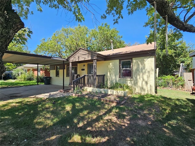 4001 SE 22nd St, Del City, OK 73115 - single story home with a front yard, brick siding, an attached carport, and driveway