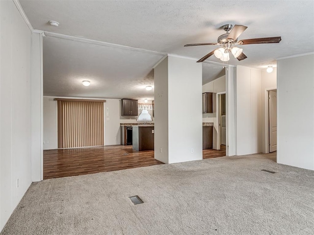 355370 E 970th Rd, Sparks, OK 74869 - unfurnished living room featuring carpet flooring, a ceiling fan, and crown molding