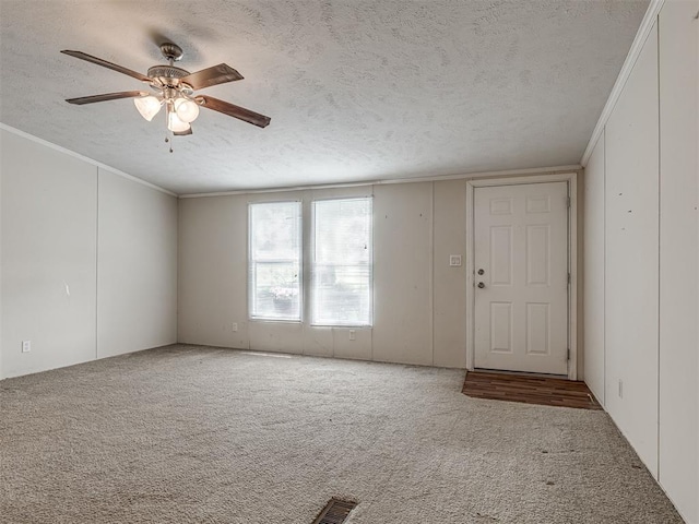 355370 E 970th Rd, Sparks, OK 74869 - carpeted spare room with a textured ceiling, crown molding, and a ceiling fan