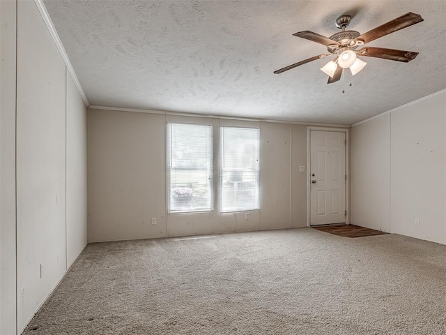 355370 E 970th Rd, Sparks, OK 74869 - empty room featuring crown molding, a textured ceiling, carpet flooring, and a ceiling fan