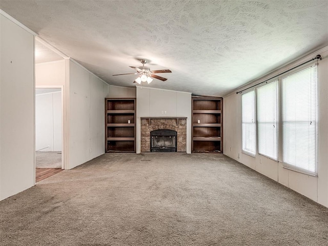 355370 E 970th Rd, Sparks, OK 74869 - unfurnished living room featuring carpet, ceiling fan, a fireplace, vaulted ceiling, and a textured ceiling
